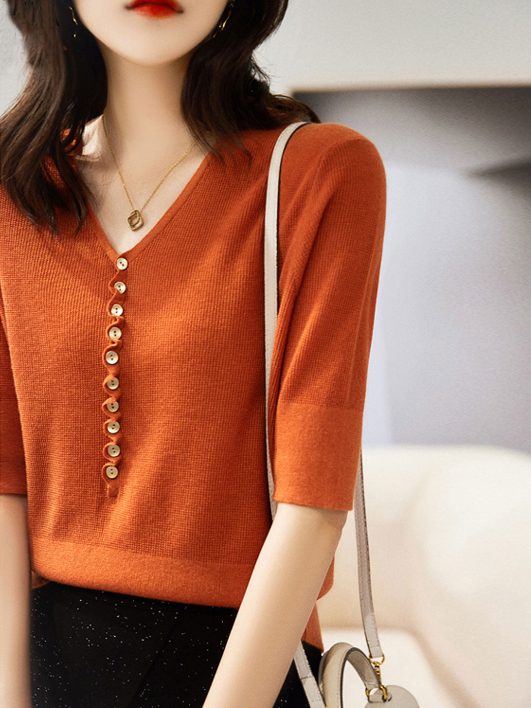 Versatile women's long sleeve V-neck top with button details for a casual yet chic everyday look.