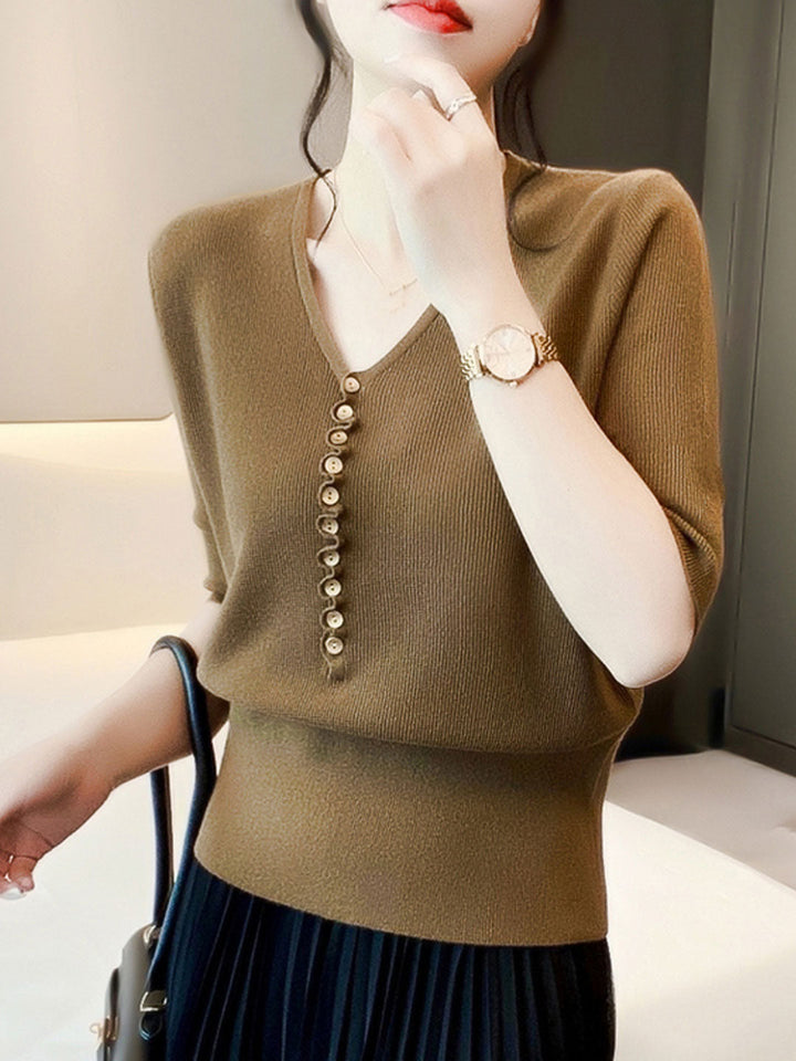 Soft women's long sleeve V-neck top with functional buttons, combining comfort with versatile fashion.