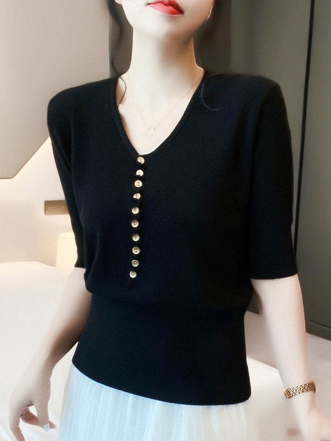 Elegant women's V-neck button-up top with long sleeves, offering a blend of chic style and comfort.