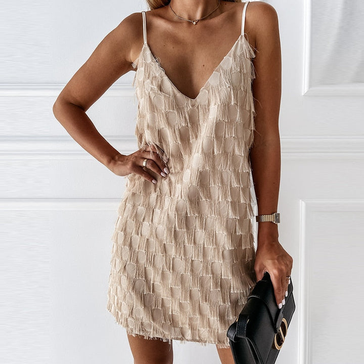 Fashionable women's V-neck sleeveless mini dress, fully adorned with dynamic fringe and tassels, ideal for occasions.