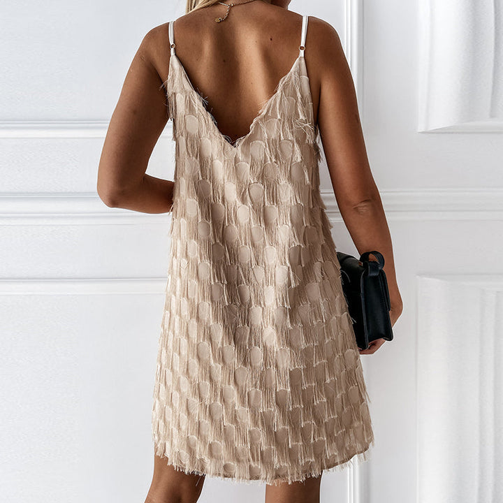 Trendy women's summer mini dress with a V-neck and sleeveless design, showcasing all-over tassel fringe apparel.