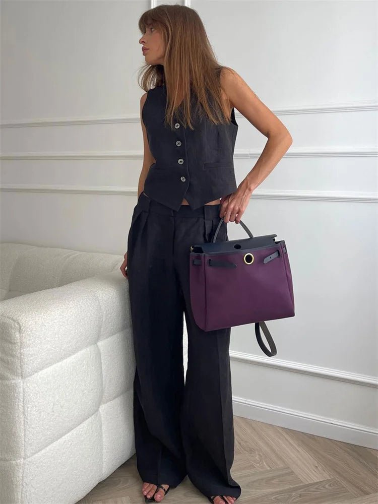 Trendy women's summer co-ord set: chic waistcoat & flowing wide-leg trousers, perfect for fashion.