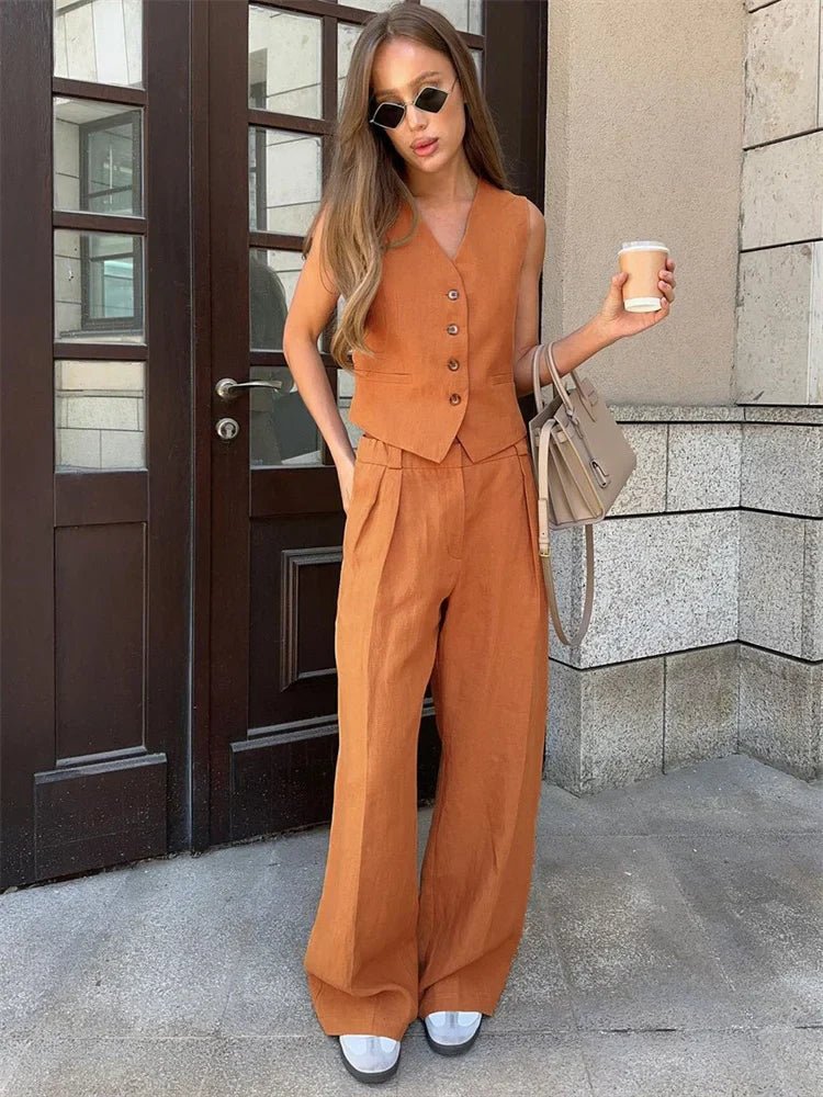 Effortless women's waistcoat set featuring a chic sleeveless top and flowing wide-leg trousers.