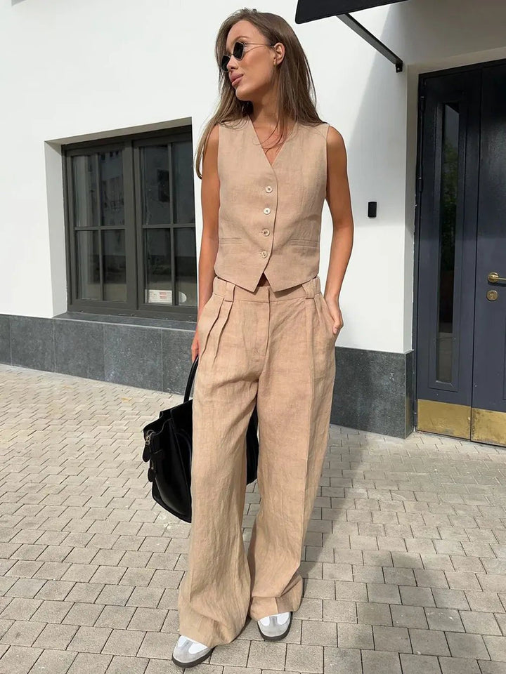 Complete women's outfit: a fashionable waistcoat and comfortable wide-leg pants for easy elegance.