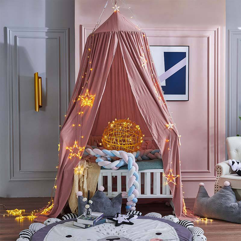 Children's black blackout bed canopy for peaceful sleep and imaginative play in nursery.