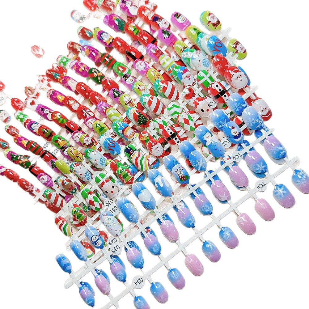 Holiday themed stick-on nails for kids, vibrant Christmas nail art, easy to apply.