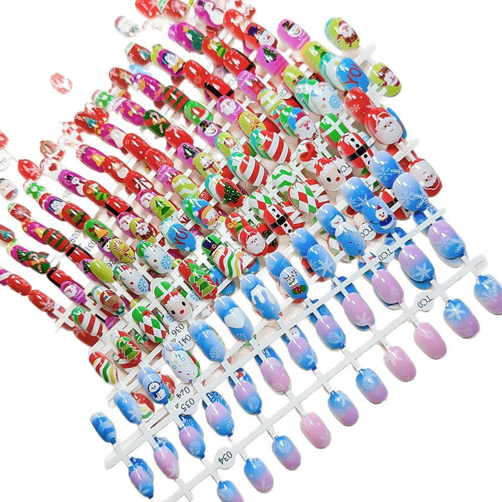 Holiday themed stick-on nails for kids, vibrant Christmas nail art, easy to apply.