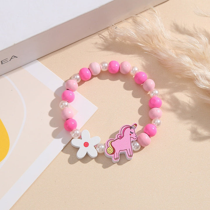 Adjustable children's bracelet with playful unicorn, flower, and colorful wooden beads.