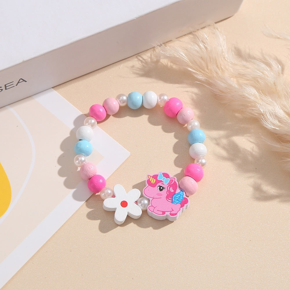 Playful unicorn & flower bracelet for children, crafted with colorful wood beads.