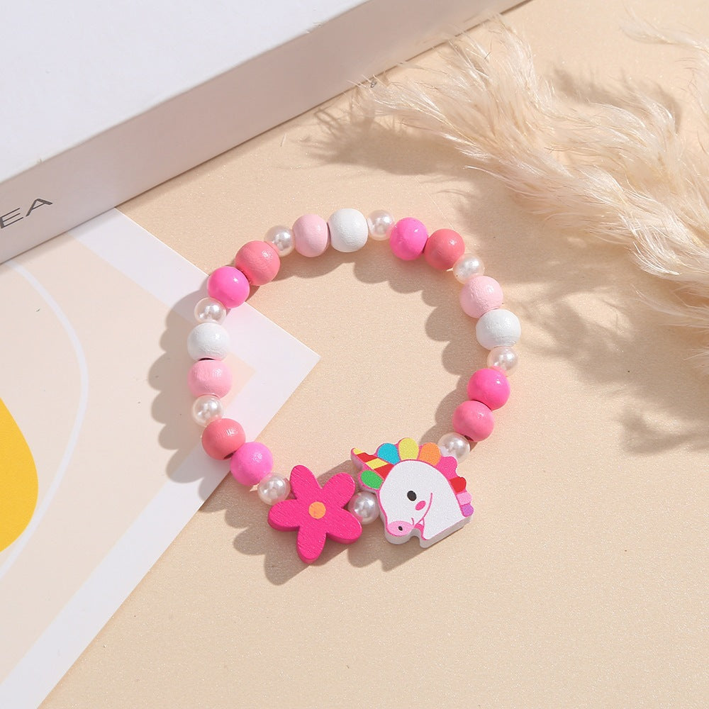 Playful children's jewelry: unicorn & flower wooden beaded bracelet for little girls.
