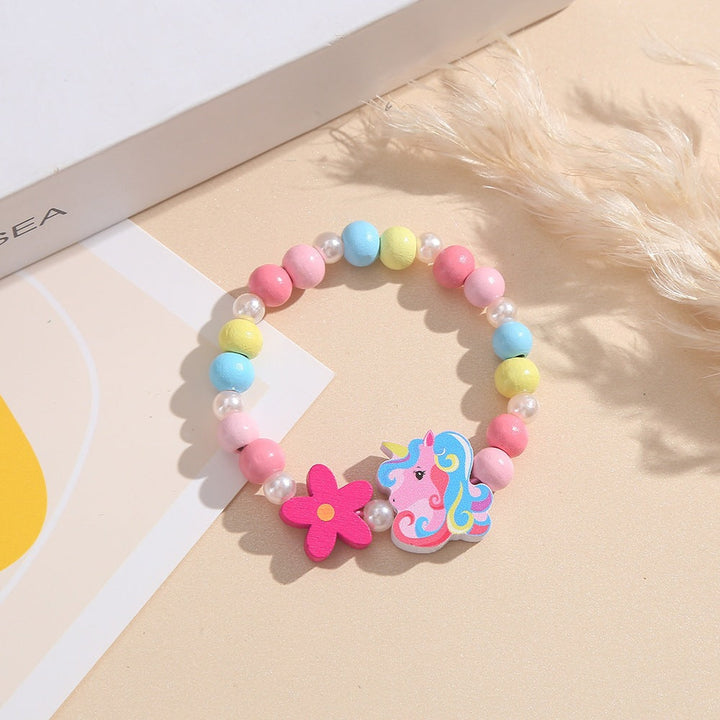 Unicorn and flower themed girls' bracelet, made with smooth wooden beads, perfect for play.