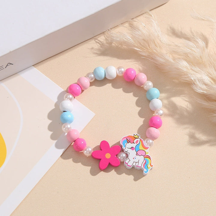 Beaded unicorn bracelet with cheerful flower accents, adjustable for children's wrists.