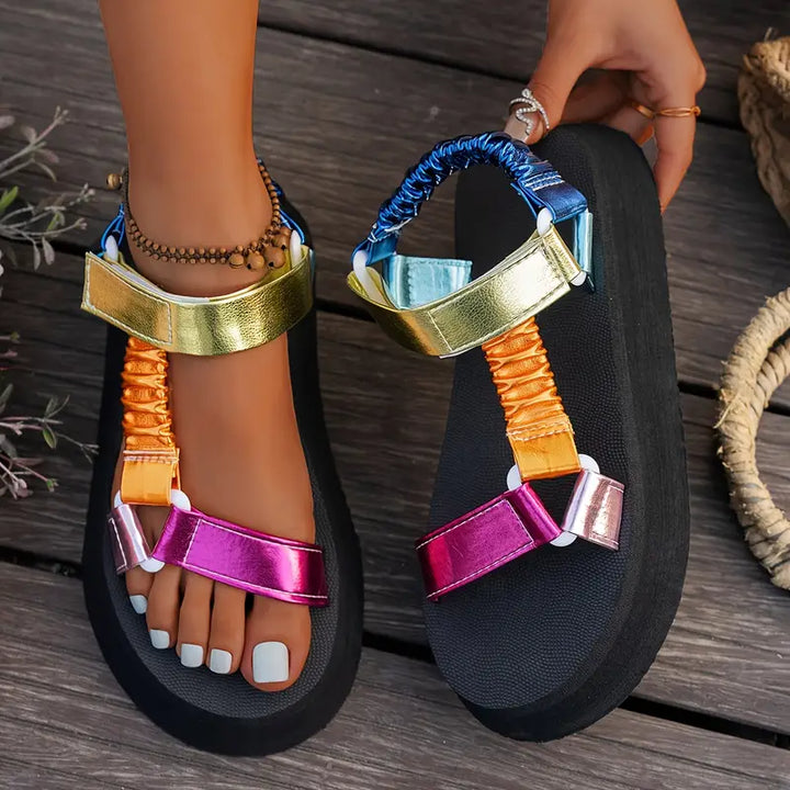 Fashionable women's iridescent sandals with a chunky platform, bringing elevated style.