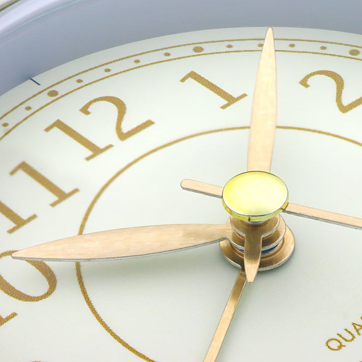Analogue alarm clock with integrated night light, silent sweep movement, and vintage charm for any room.