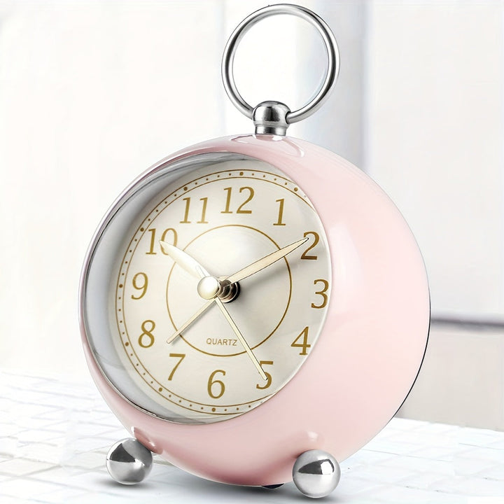 Simple classic analogue alarm clock with a night light, quiet operation, and clear time display.
