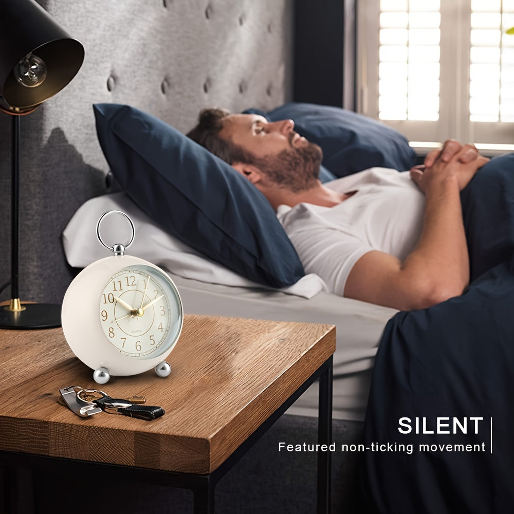 Durable classic analogue alarm clock, retro style with a handy night light, perfect for daily use.