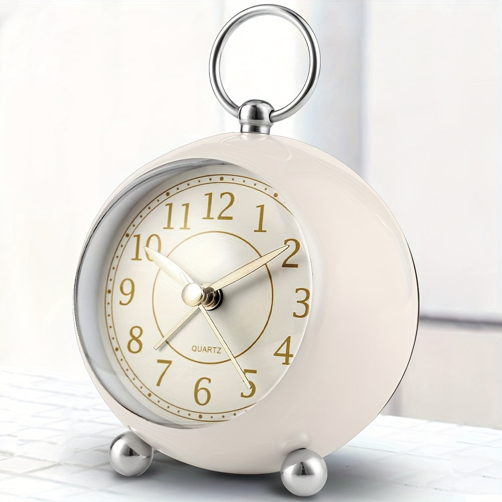 Retro vintage analogue alarm clock with soft night light, perfect for bedside table or home office.
