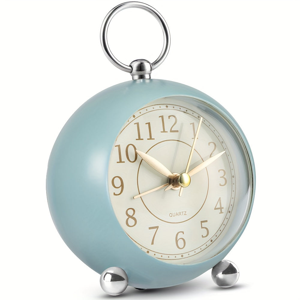 Quiet classic analogue alarm clock with gentle night light and easy-to-read face for peaceful mornings.