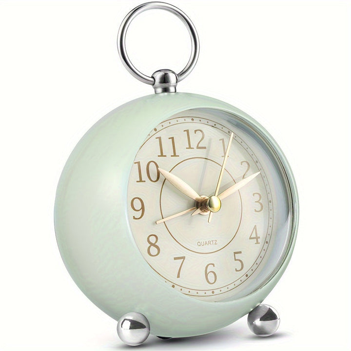 Round classic analogue alarm clock, vintage design with night light, a stylish retro bedroom timepiece.
