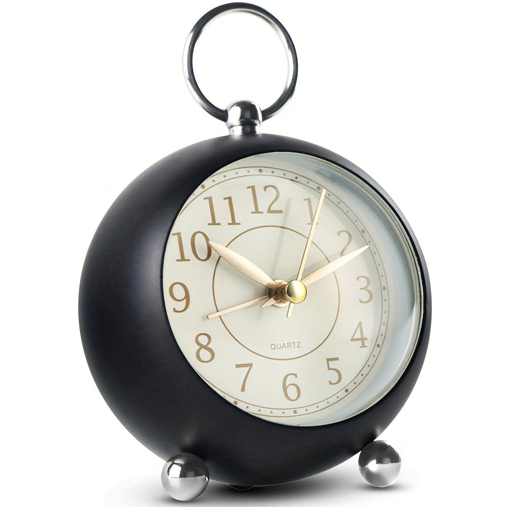 Elegant classic analogue alarm clock, retro round design, features night light for easy viewing at night.