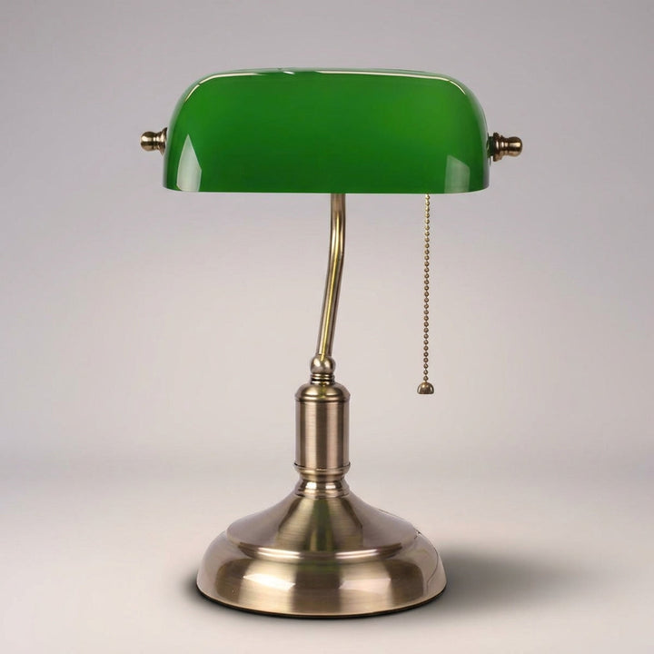 Green glass shade banker lamp with polished metal base. Ideal vintage desk lighting for home or office.