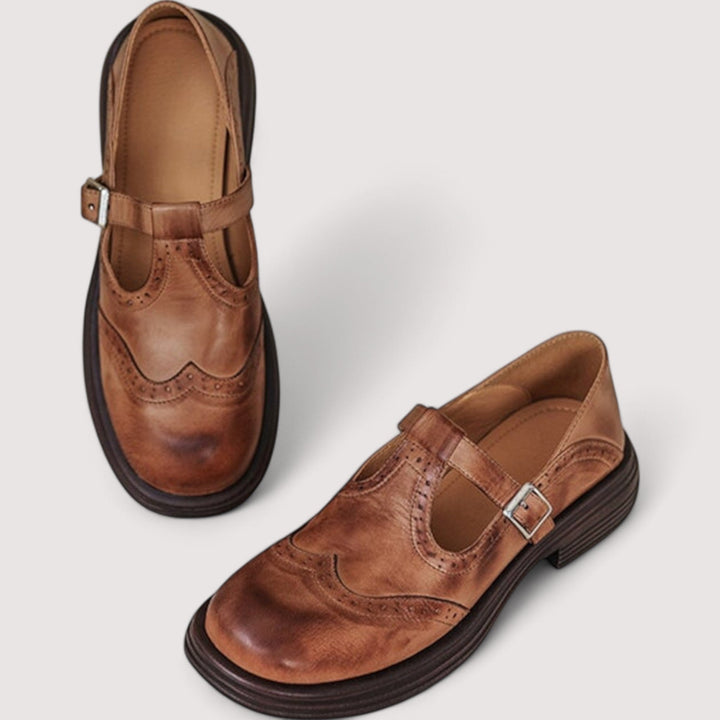 Comfortable brown leather women's Mary Jane shoes with classic buckle closure. Versatile flats for daily or dress wear.