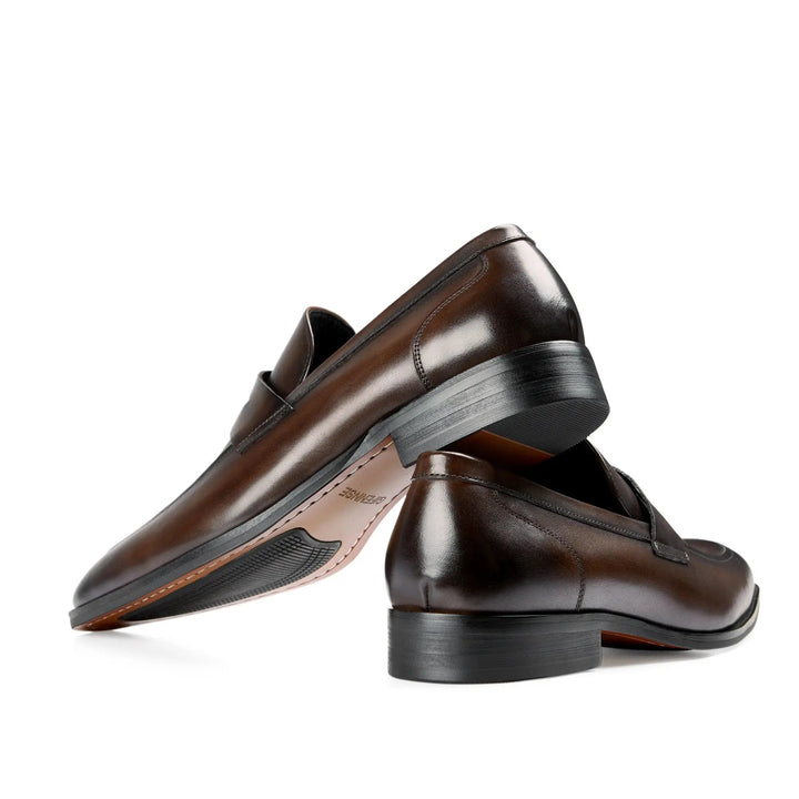 Men's classic slip-on penny loafers, essential versatile footwear for both dressy and relaxed looks.