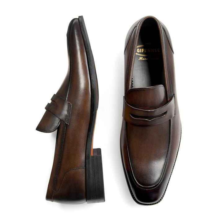 Sophisticated mens black penny loafers, comfortable and timeless fashion footwear, easy slip-on.