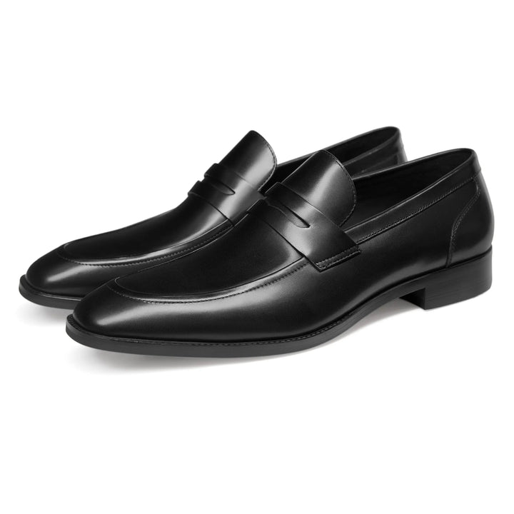 Comfortable men's slip-on penny loafers in elegant leather, versatile for dress or casual wear.