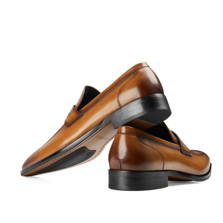 Elegant brown slip-on penny loafers for men, comfortable fashion footwear for any occasion.