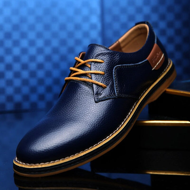 Classic black men's Oxford dress shoes, ideal for formal business attire, elegant events, or smart casual fashion.