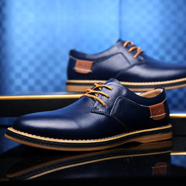 Stylish men's black oxford shoes, versatile formal footwear for professional settings and elegant events.