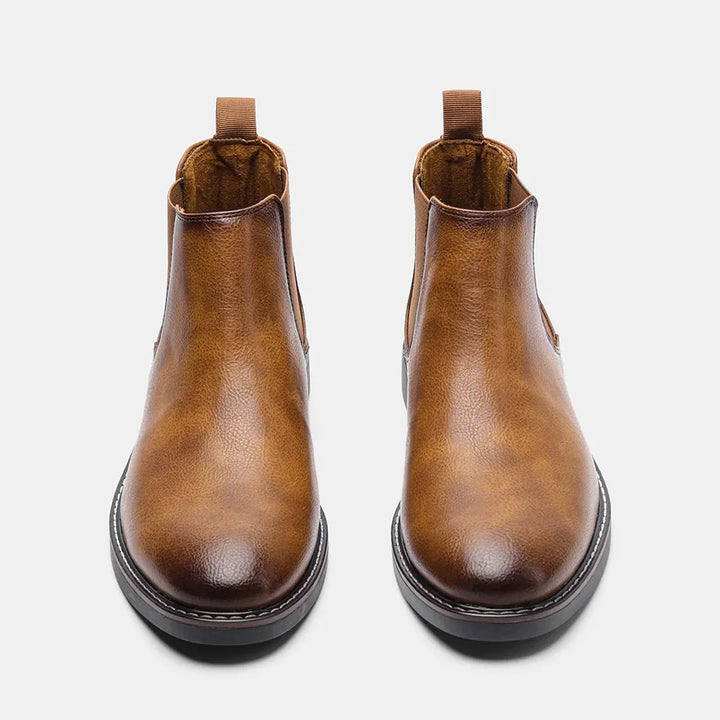 Tan leather men's Chelsea boots, timeless ankle style, offering sleek design and comfort.
