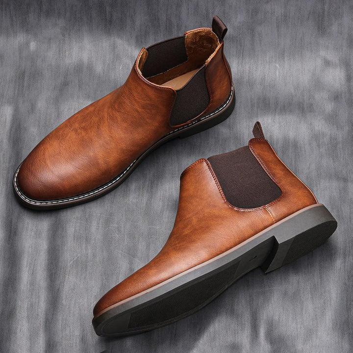 Stylish men's ankle boots, dark brown Chelsea style, elegant & versatile for modern menswear.