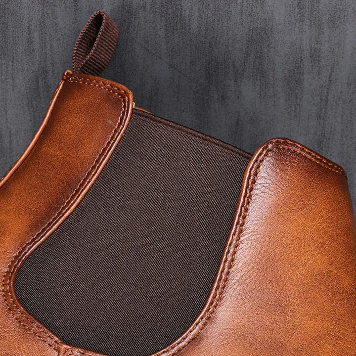 Sleek men's Chelsea boots, genuine leather, pull-on design for easy on/off, dressy or casual.