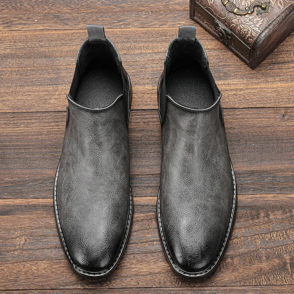 Men's dress Chelsea boots, sophisticated ankle footwear, perfect for formal or smart-casual outfits.