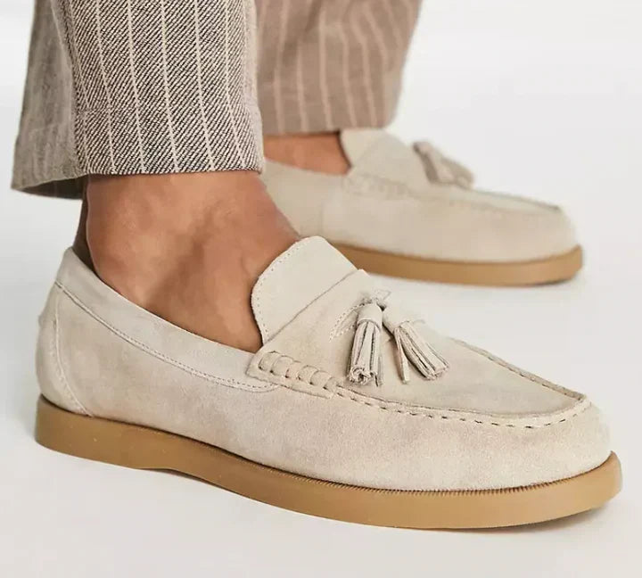 Classic men's beige slip-on loafers, elegant & comfortable. Versatile footwear for formal or casual occasions.