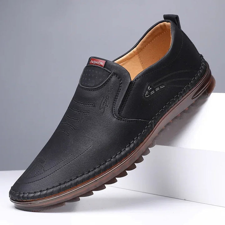 Comfortable men's classic slip-on loafers in premium leather, ideal for everyday casual or smart formal occasions.