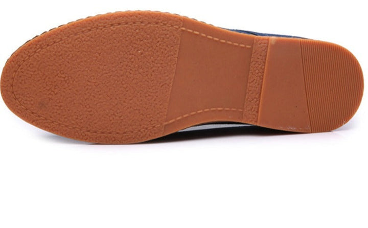 Comfortable men's black oxford shoes in motion, ideal for timeless walking style & formal elegance.
