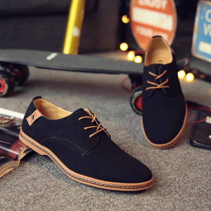 Angled shot of sophisticated black oxford shoes, embodying timeless men's formal fashion and elegant style.