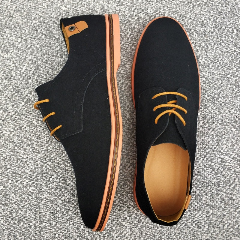 Refined toe cap of classic men's brown leather oxford shoes, showcasing sleek design & formal elegance.