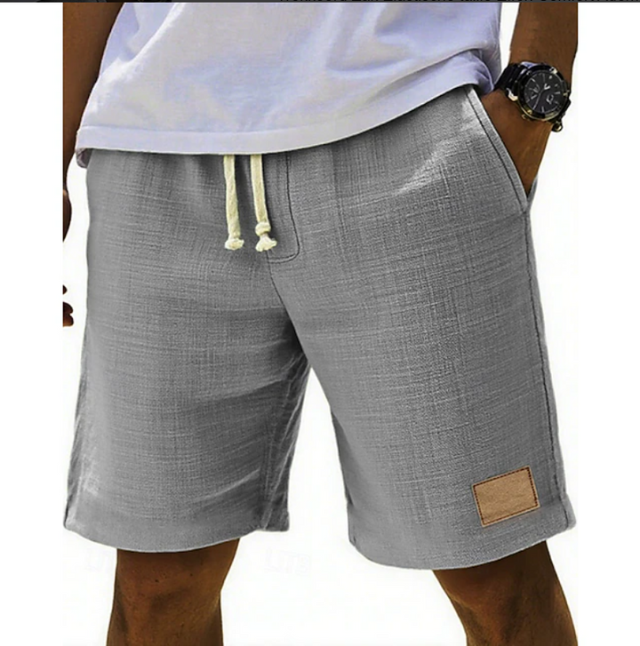 Comfortable men's relaxed fit drawstring shorts, ideal for beach days, vacation & everyday style.