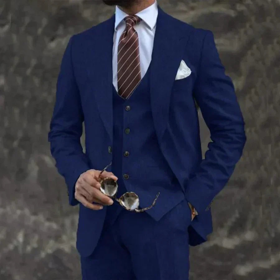 Men's elegant three-piece suit. Tailored blazer, waistcoat, and trousers for sophisticated formal wear.