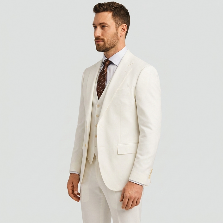Refined men's three-piece suit. Tailored blazer, waistcoat & trousers, ideal for formal and business.