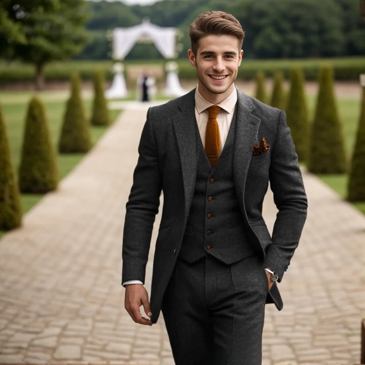 Stylish men's grey three-piece suit, ideal for formal parties & wedding guests.