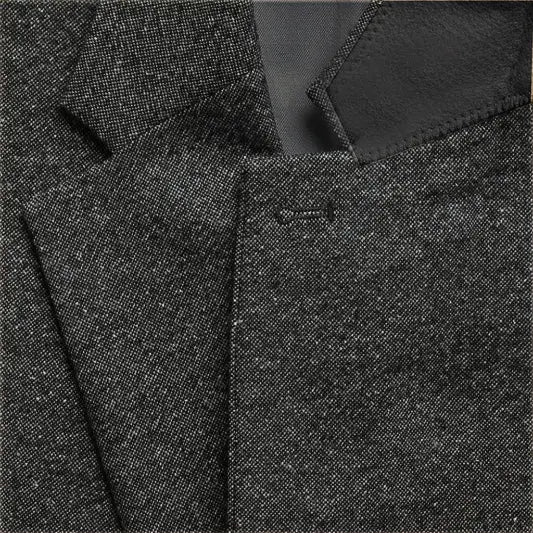 Men's tailored three-piece suit, perfect for a dapper gentleman at any event.