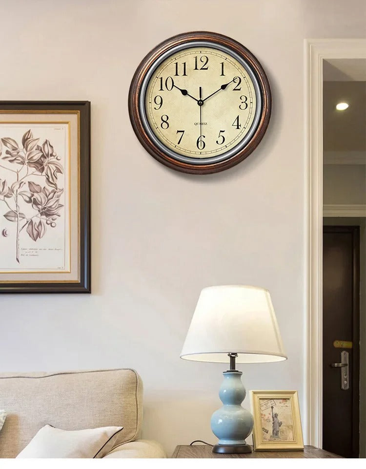Elegant silent quartz wall clock for living room, kitchen, or office. Classic round metal design.