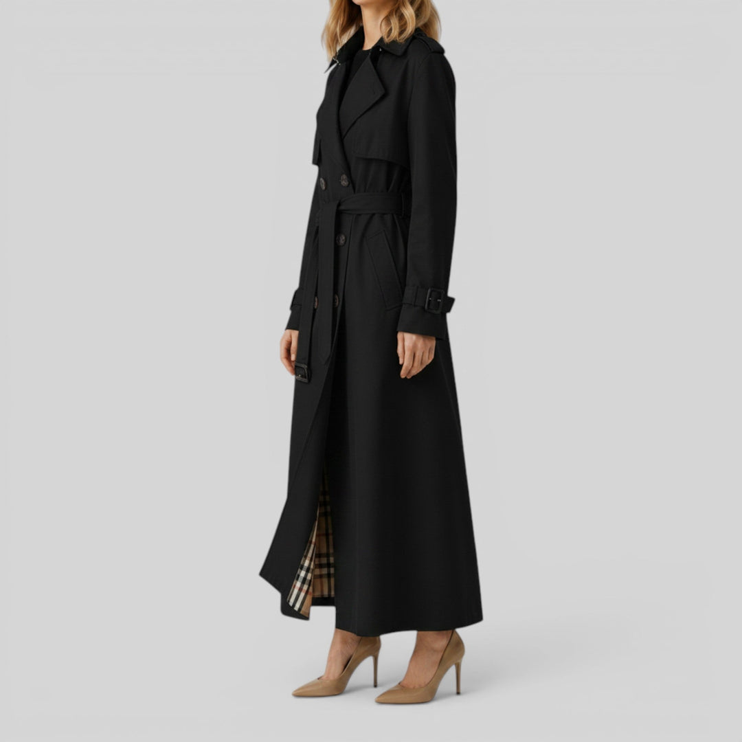 Chic women's belted trench coat. Double-breasted longline outerwear for elegant autumn fashion.