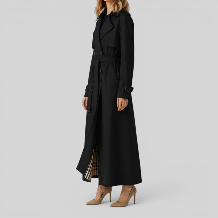Chic women's belted trench coat. Double-breasted longline outerwear for elegant autumn fashion.