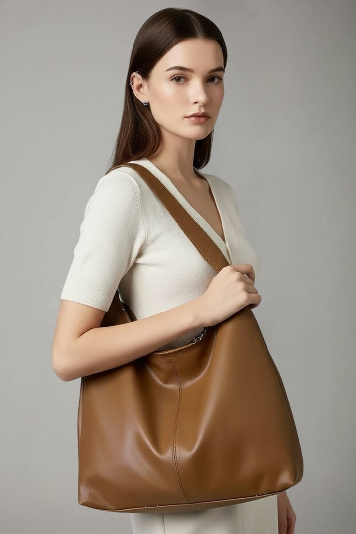 Stylish women's classic faux leather shoulder tote bag. Large capacity everyday handbag with convenient inner pocket.